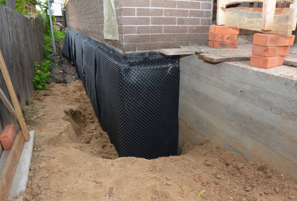 Happy homeowners after waterproofing job in Delano